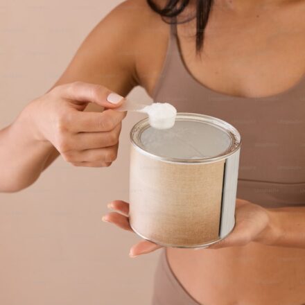 Creatine monohydrate powder with measuring scoop for daily supplementation