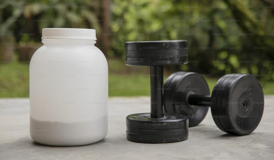 Creatine monohydrate powder with measuring scoop for longevity and cognitive benefits