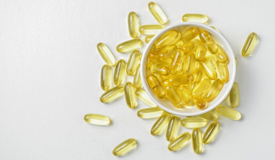 Fish oil omega-3 softgel capsules in a white bowl - CoreStacks 2026 fish oil buying guide